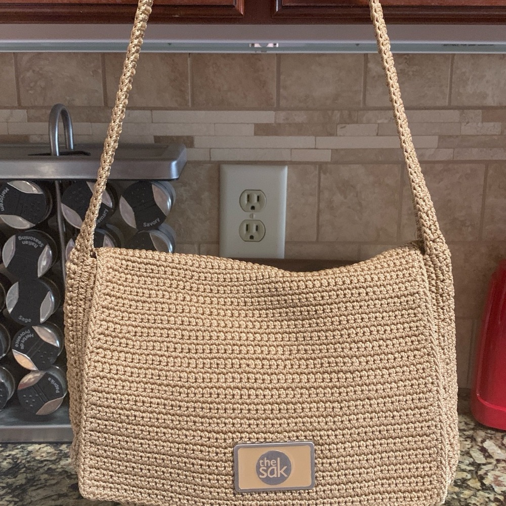 The Sak Tan Crochet Shoulder Bag with Flap Closure